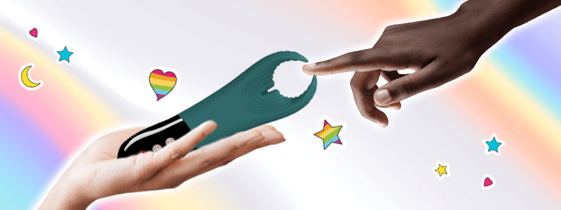 One person holds the Manta by Fun Factory out to a second person, who extends a finger to touch the tips. Behind their hands is a rainbow background and the image is accented by rainboe hearts and stars.